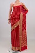 Red Mysore Crepe Saree with Stripes on the body and Zari Border.  displayed on a mannequin