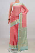 Peach Mysore Crepe Saree with Zari Butta on the body and Zari Border.  displayed on a mannequin