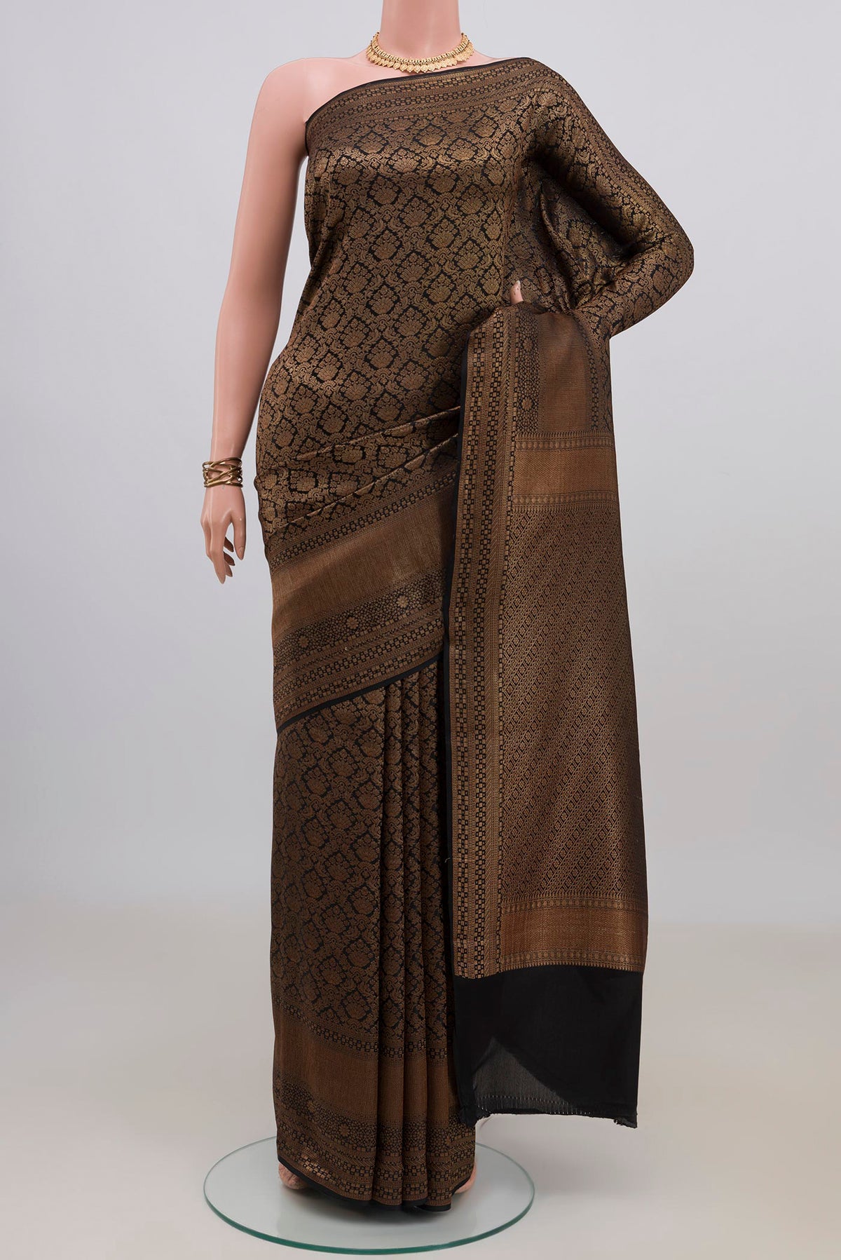 Black Mysore Crepe Saree with Zari Brocade on the body and Zari Border.  displayed on a mannequin