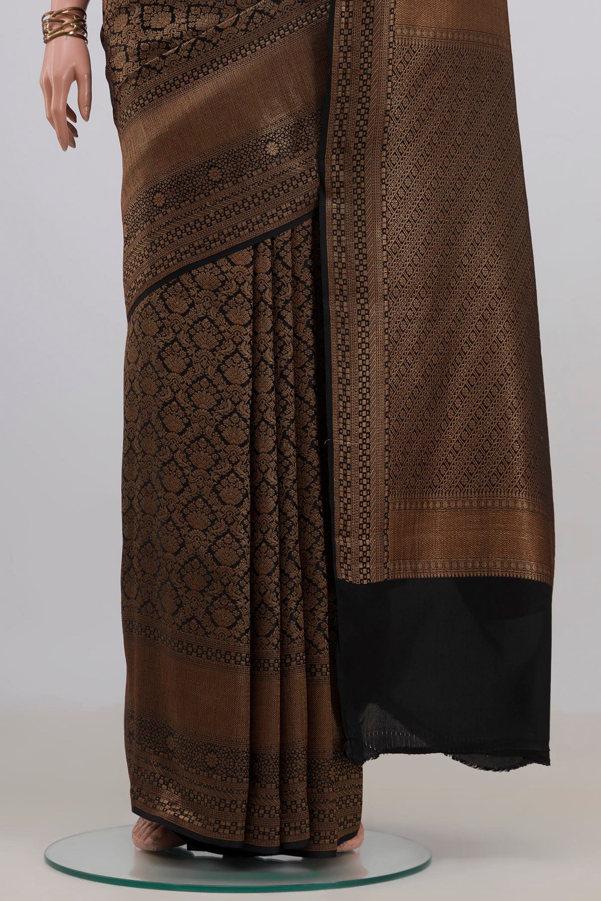 Pleats and pallu of Black Mysore Crepe Saree with Zari Brocade on the body and Zari Border. 
