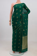 Green Mysore Crepe Saree with Zari Butta on the body and Thin Zari Line.  displayed on a mannequin