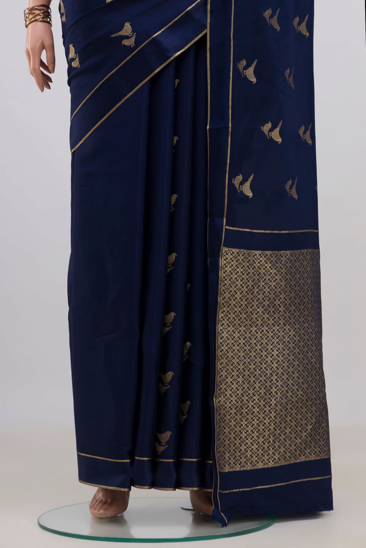 Pleats and pallu of Navy Blue Mysore Crepe Saree with Zari Butta on the body and Thin Zari Line. 