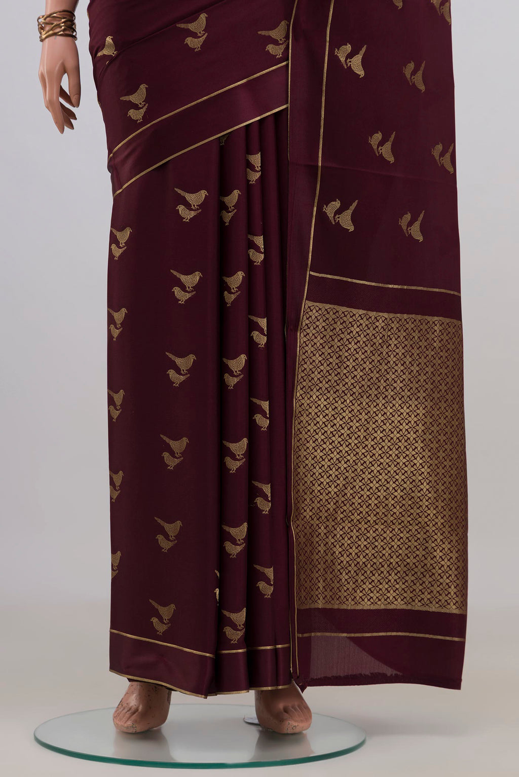 Pleats and pallu of Coffee Brown Mysore Crepe Saree with Zari Butta on the body and Thin Zari Line. 