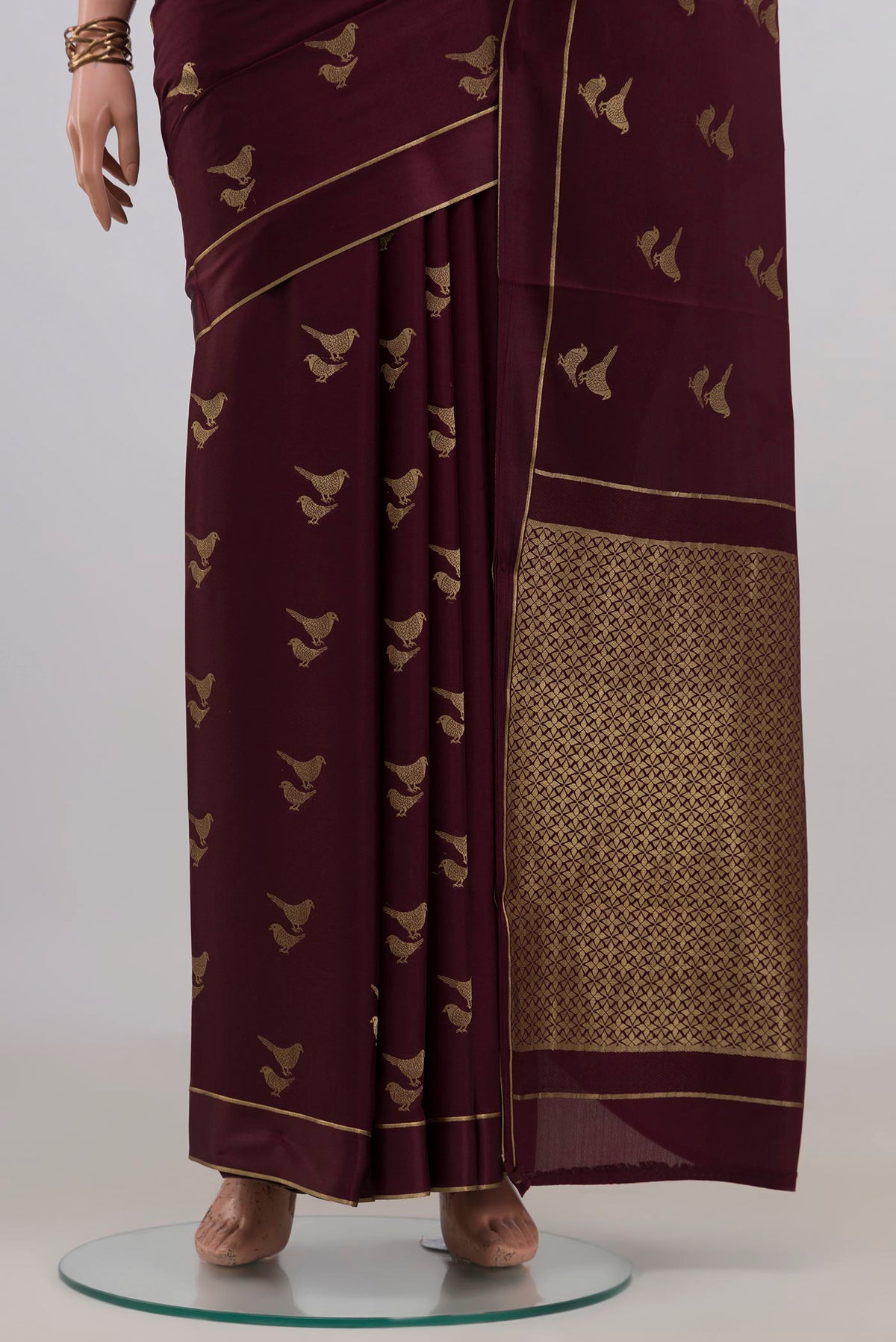Pleats and pallu of Coffee Brown Mysore Crepe Saree with Zari Butta on the body and Thin Zari Line. 