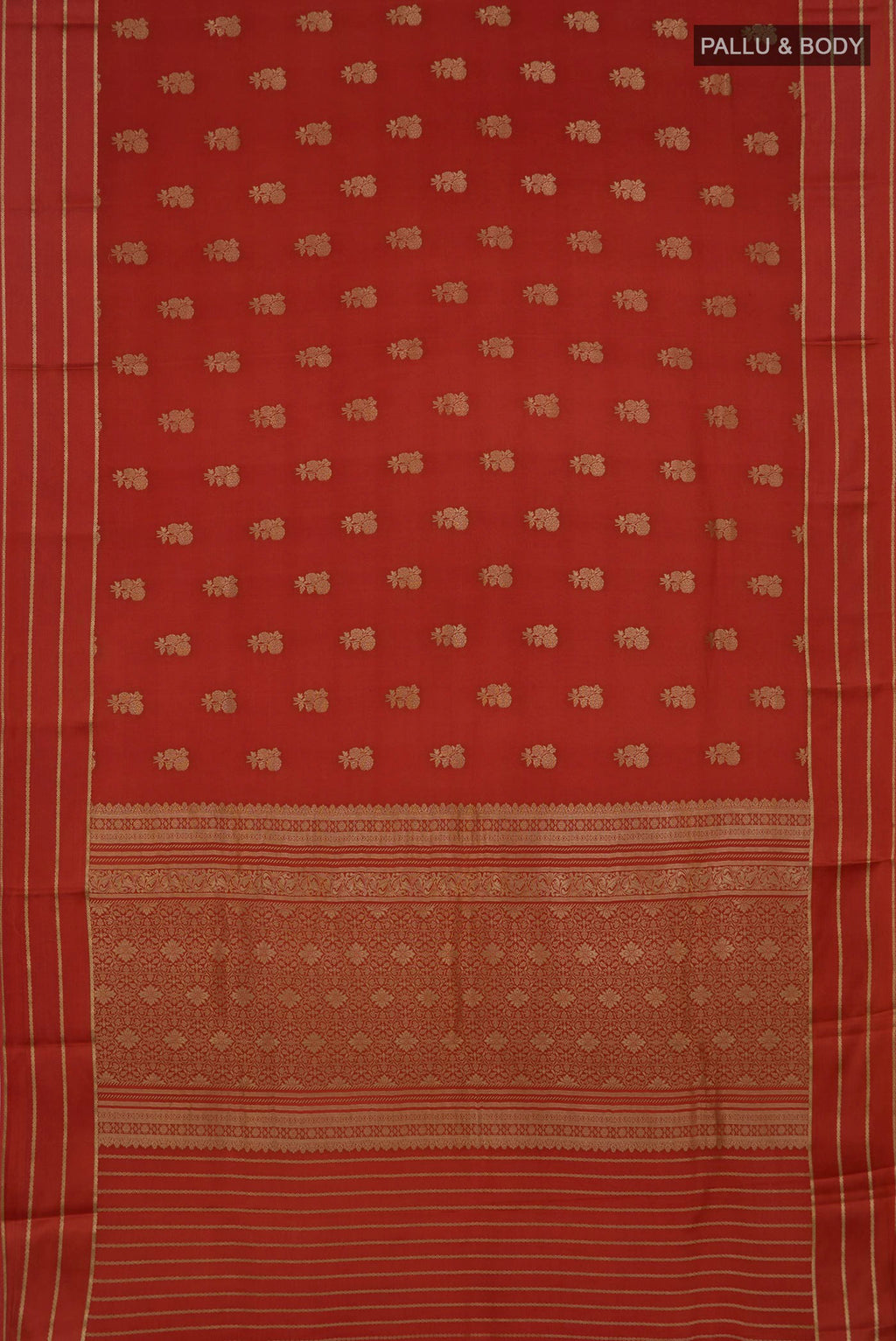 Flat view of Rust Mysore Crepe Saree with Zari Butta on the body and Thin Zari Line. 