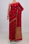 Red Mysore Crepe Saree with Zari Butta on the body and Zari Border.  displayed on a mannequin