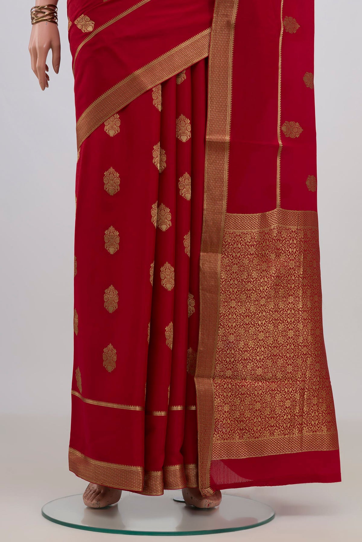 Pleats and pallu of Red Mysore Crepe Saree with Zari Butta on the body and Zari Border. 