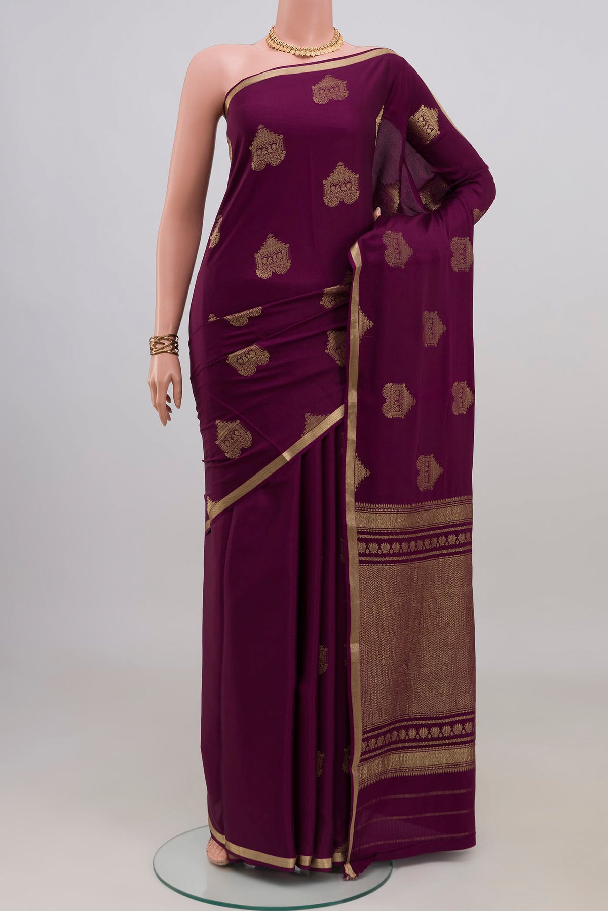 Purple Mysore Crepe Saree with Zari Butta on the body and Zari Border.  displayed on a mannequin