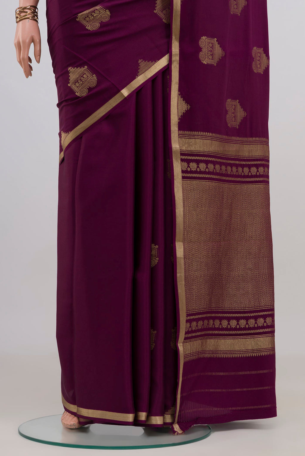 Pleats and pallu of Purple Mysore Crepe Saree with Zari Butta on the body and Zari Border. 
