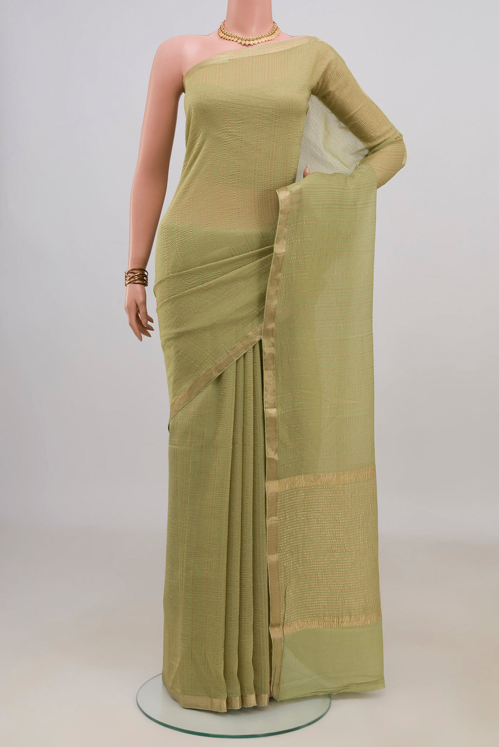 Light Green Mysore Georgette Saree with Stripes on the body and Thin Zari Line.  displayed on a mannequin