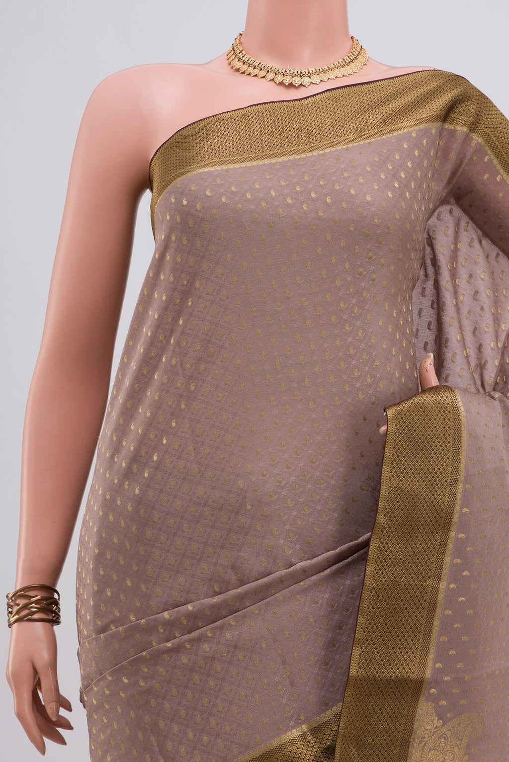 Border image of Grey Crepe Saree with Fancy on the body and Zari Border. 