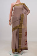 Grey Crepe Saree with Fancy on the body and Zari Border.  displayed on a mannequin