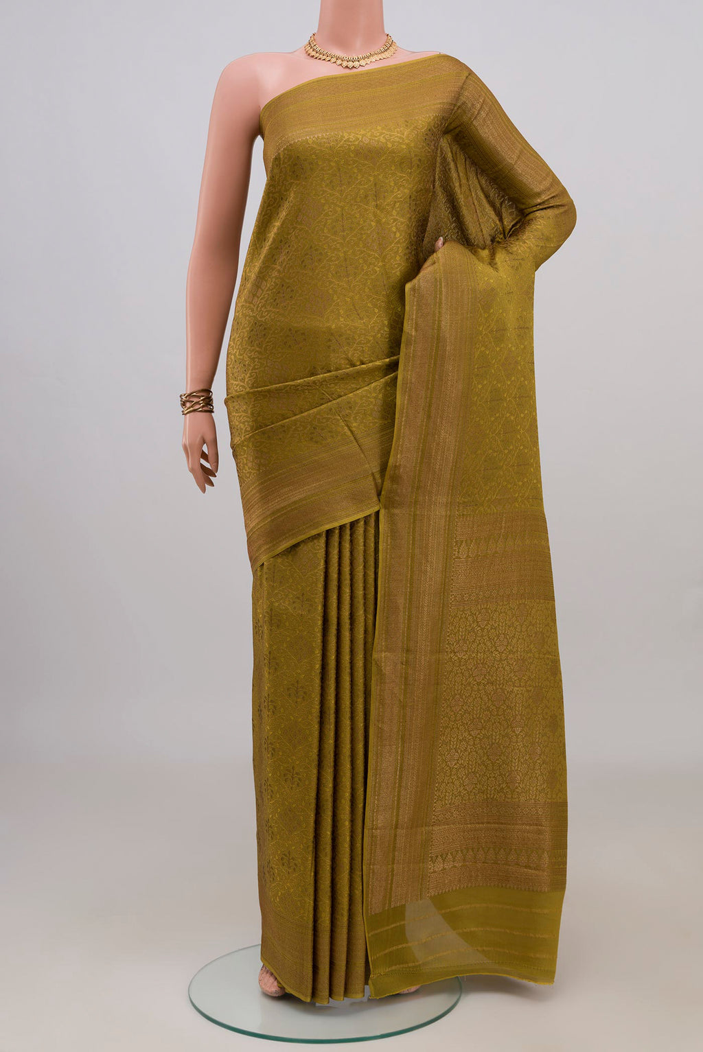 Mehandi Green Mysore Crepe Saree with Zari Brocade on the body and Zari Border.  displayed on a mannequin
