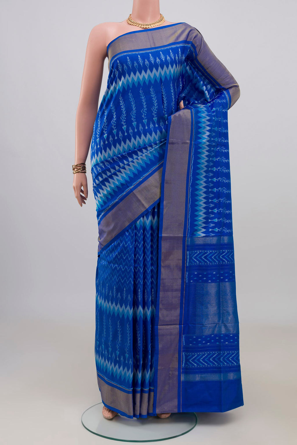 Pure Silk Royal Blue Pochampally Saree with Pure Ikat on the body and Zari Border.  displayed on a mannequin