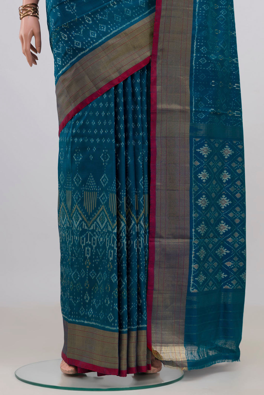 Pleats and pallu of Pure Silk Peacock Blue Pochampally Saree with Pure Ikat on the body and Zari Border. 
