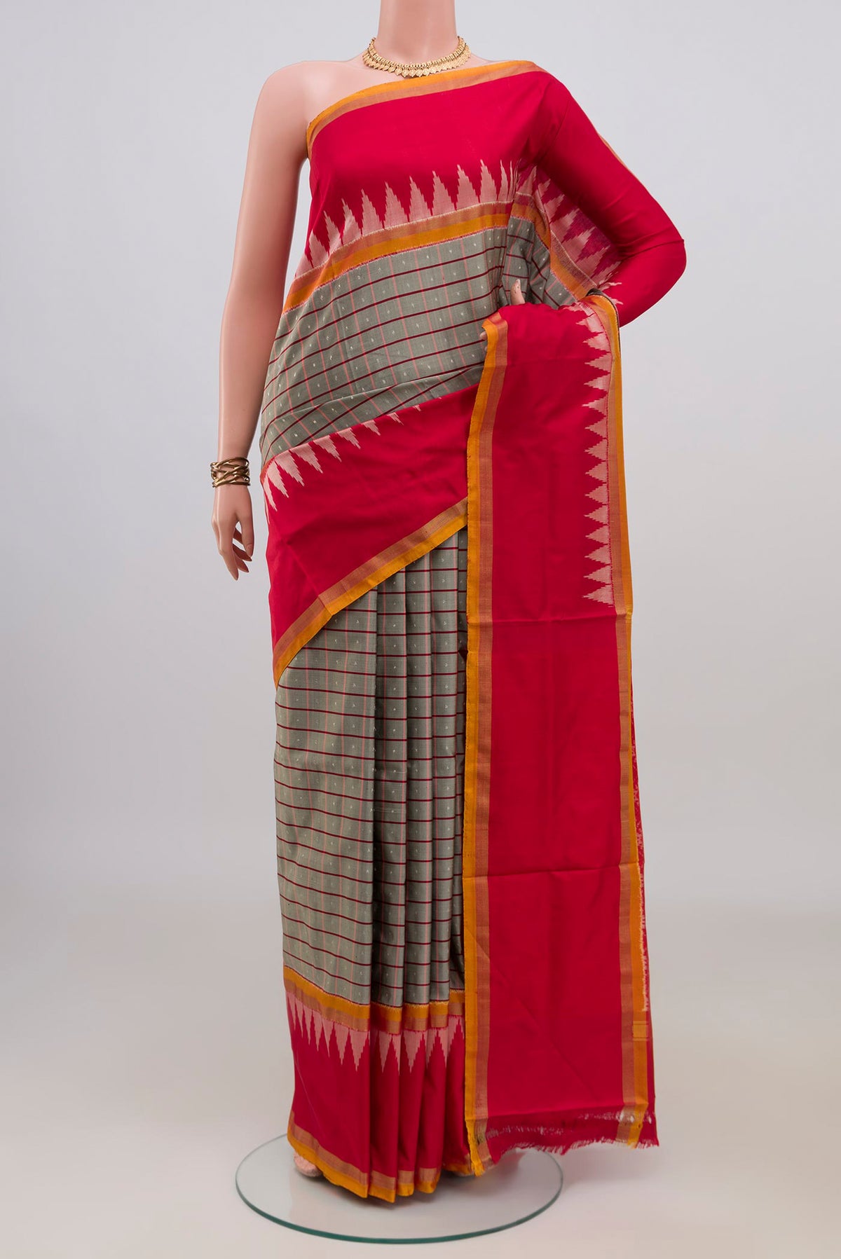 Pure Silk Grey Pochampally Saree with Checked design on the body and Thin Zari Line.  displayed on a mannequin