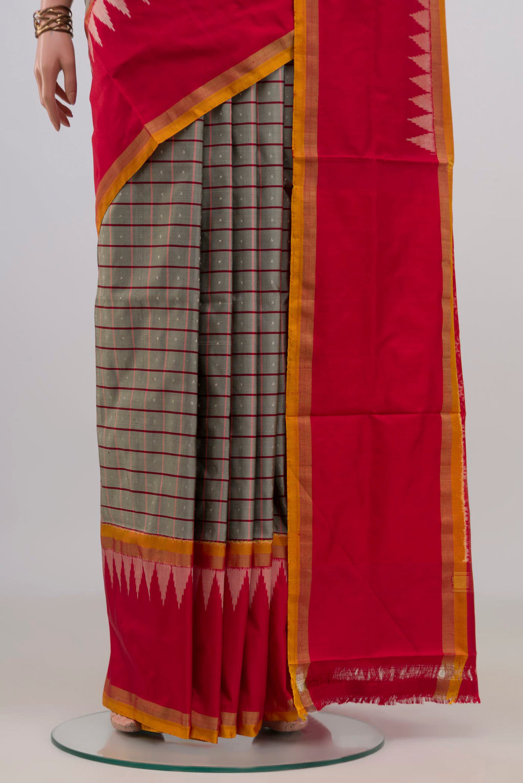 Pleats and pallu of Pure Silk Grey Pochampally Saree with Checked design on the body and Thin Zari Line. 