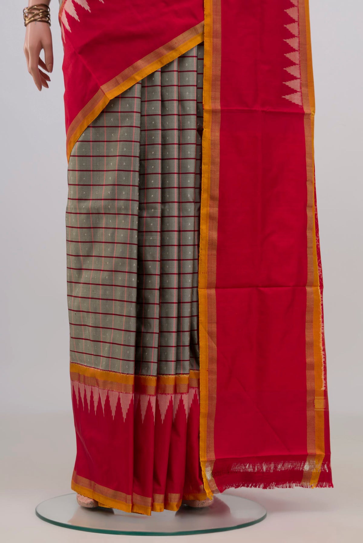 Pleats and pallu of Pure Silk Grey Pochampally Saree with Checked design on the body and Thin Zari Line. 