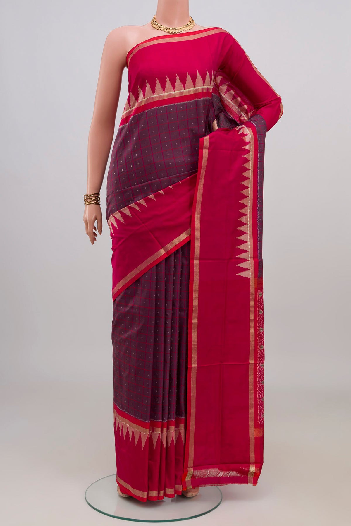 Purple Pochampally Silk Saree with Ikat design on the body and Thin Zari Line.  displayed on a mannequin