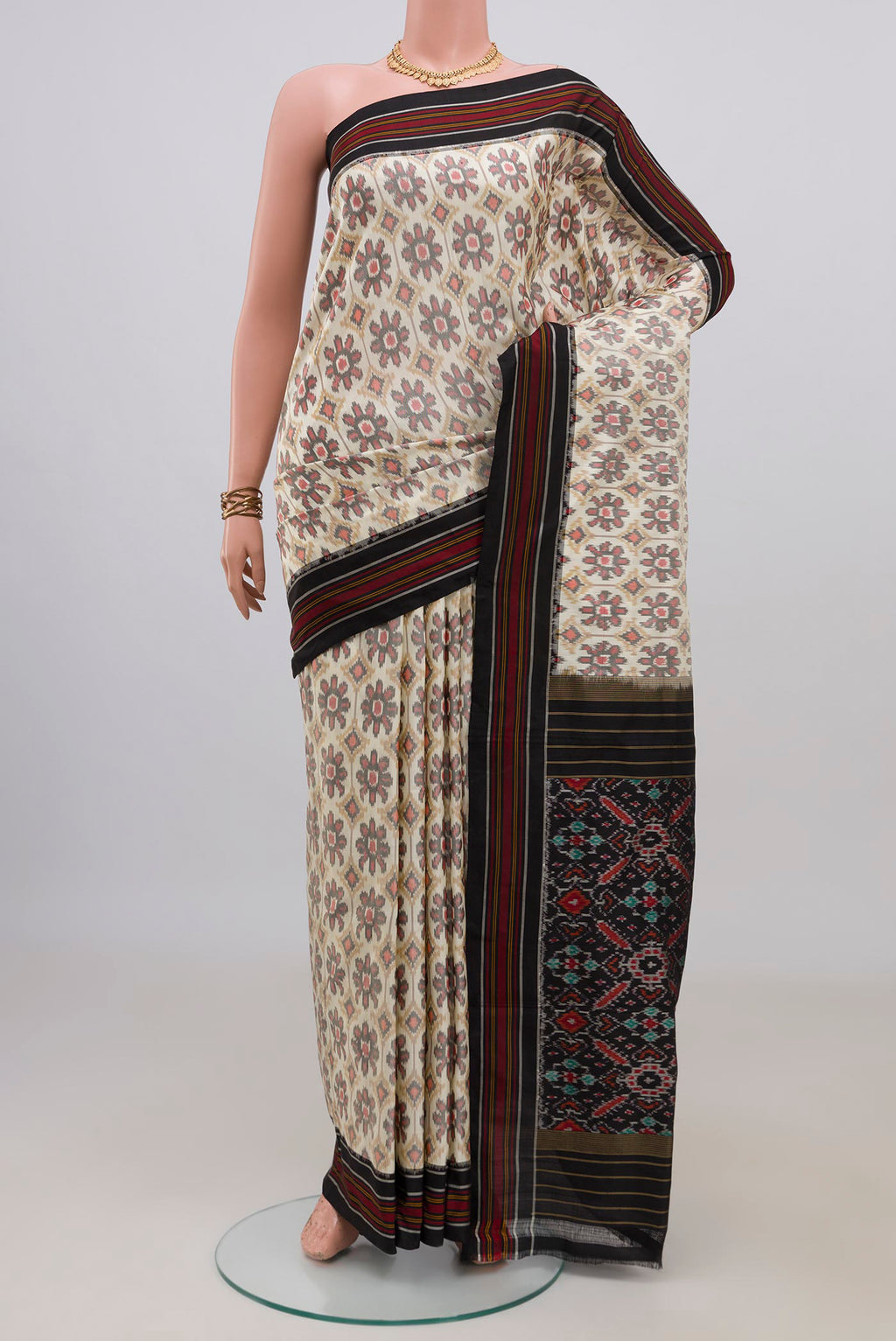 Pure Silk Cream Pochampally Saree with Ikat design on the body and Plain Border.  displayed on a mannequin