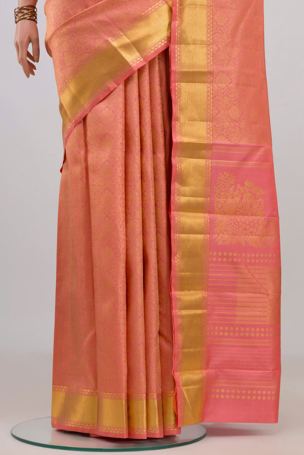 Pleats and pallu of Pure Silk Coral Kanchipuram Saree with Zari Brocade on the body and Zari Border. 