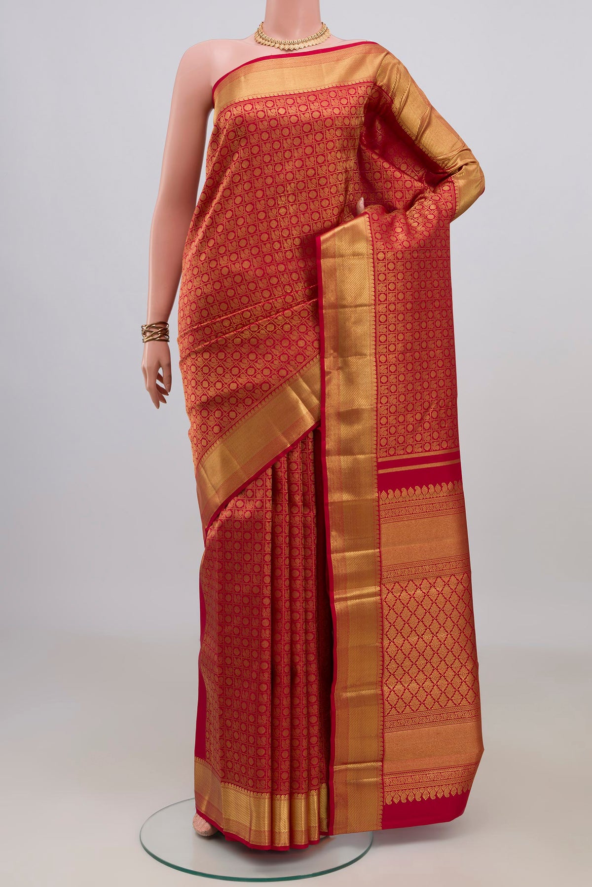 Pure Silk Pure Zari Red Kanjivaram Saree with Zari Brocade on the body and Zari Border.  displayed on a mannequin