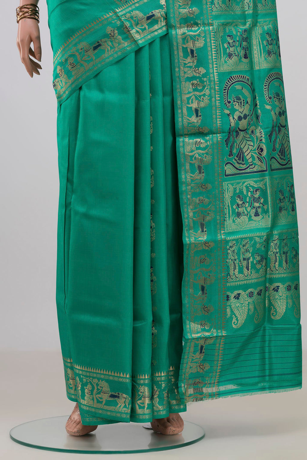 Pleats and pallu of Pure Silk Green Baluchari Saree with Zari And Thread Butta on the body and Fancy Border. 