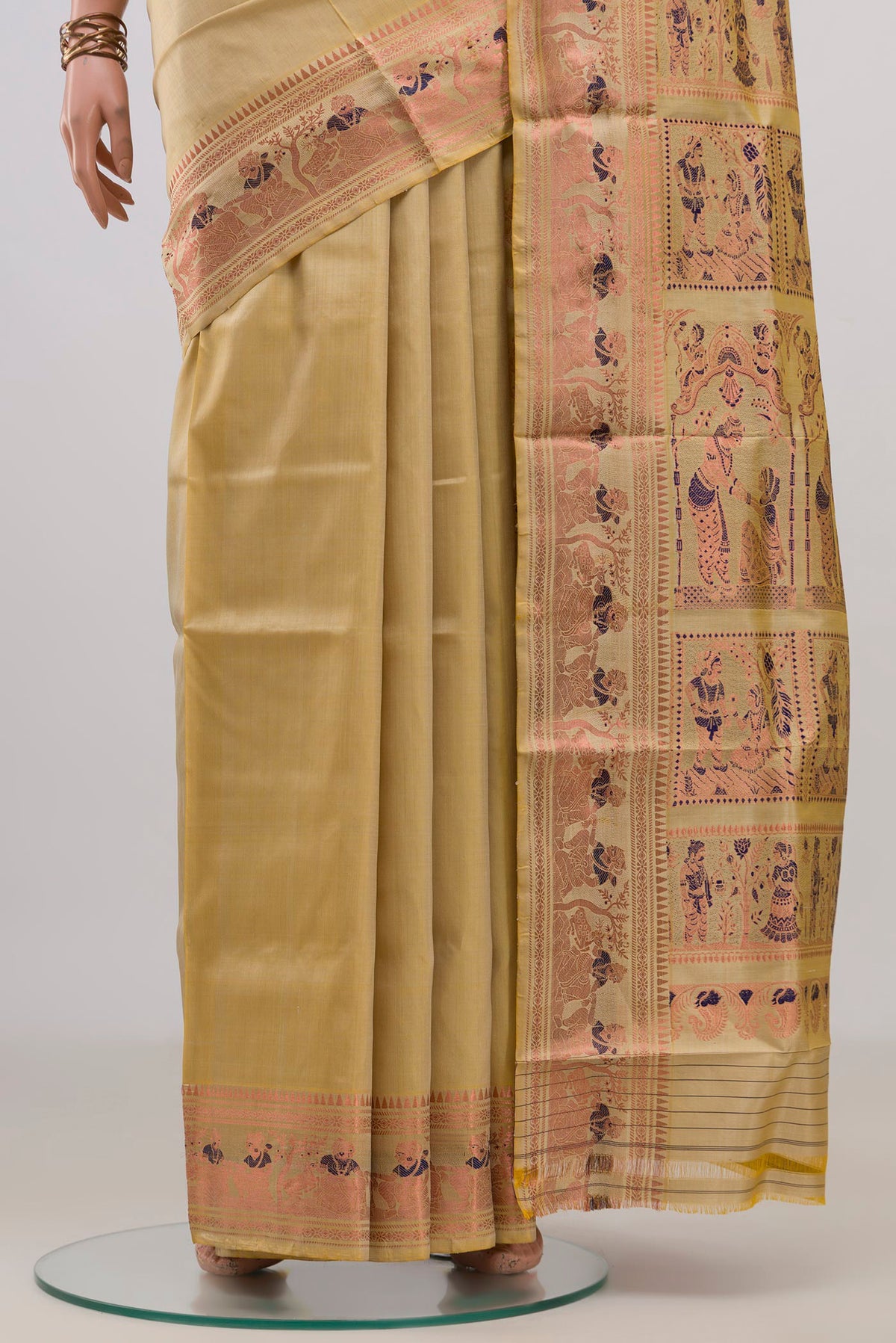 Pleats and pallu of Pure Silk Sandal Baluchari Saree with Zari And Thread Butta on the body and Fancy Border. 