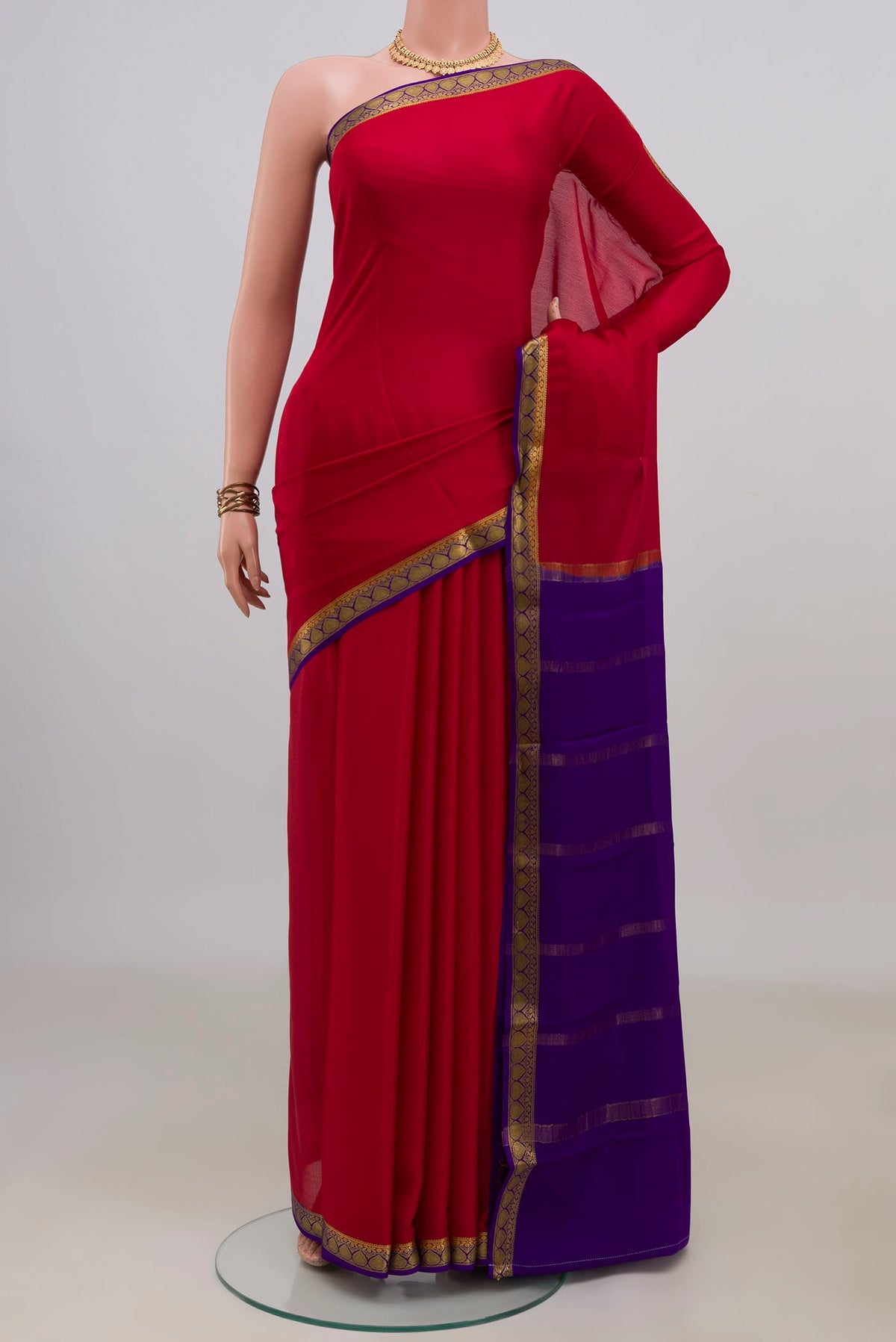 Red Mysore Crepe Saree with Plain Body and Zari Border.  displayed on a mannequin