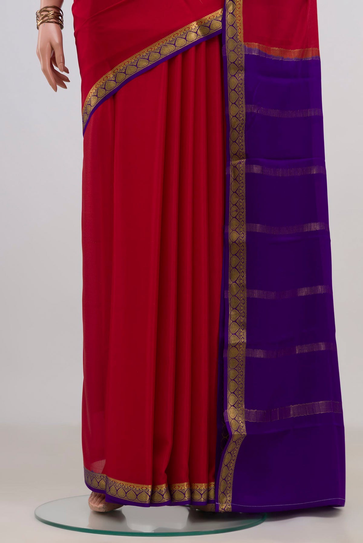 Pleats and pallu of Red Mysore Crepe Saree with Plain Body and Zari Border. 