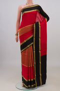 Red Mysore Crepe Saree with Zari Brocade on the body and Fancy Border.  displayed on a mannequin