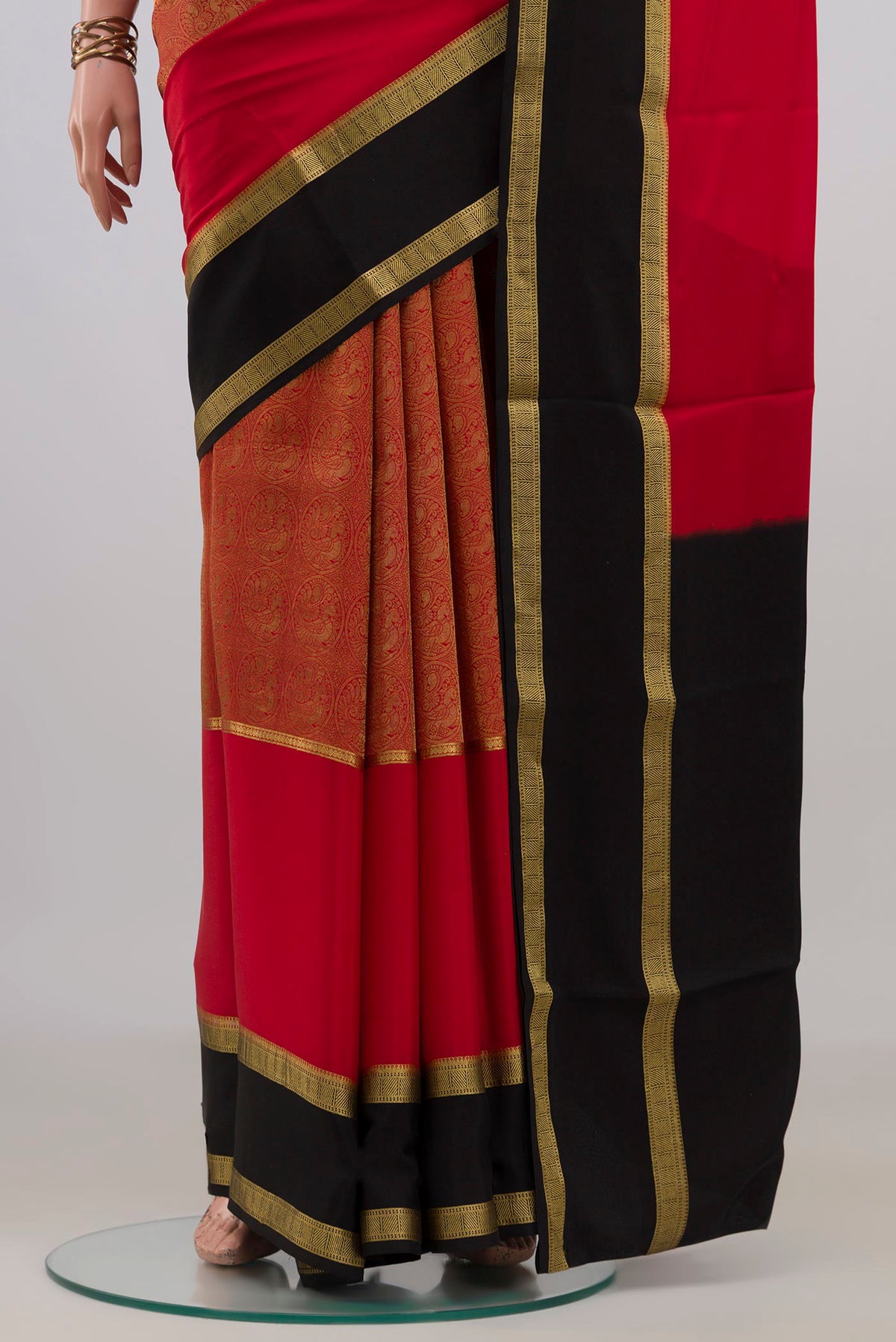 Pleats and pallu of Red Mysore Crepe Saree with Zari Brocade on the body and Fancy Border. 
