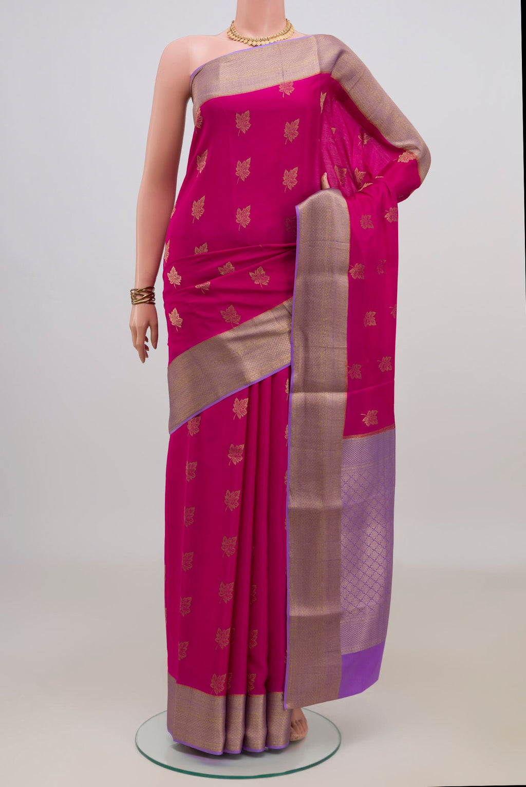 Pink Mysore Crepe Saree with Zari Butta on the body and Zari Border.  displayed on a mannequin