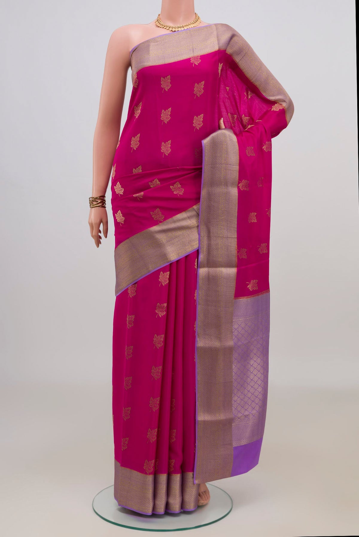 Pink Mysore Crepe Saree with Zari Butta on the body and Zari Border.  displayed on a mannequin