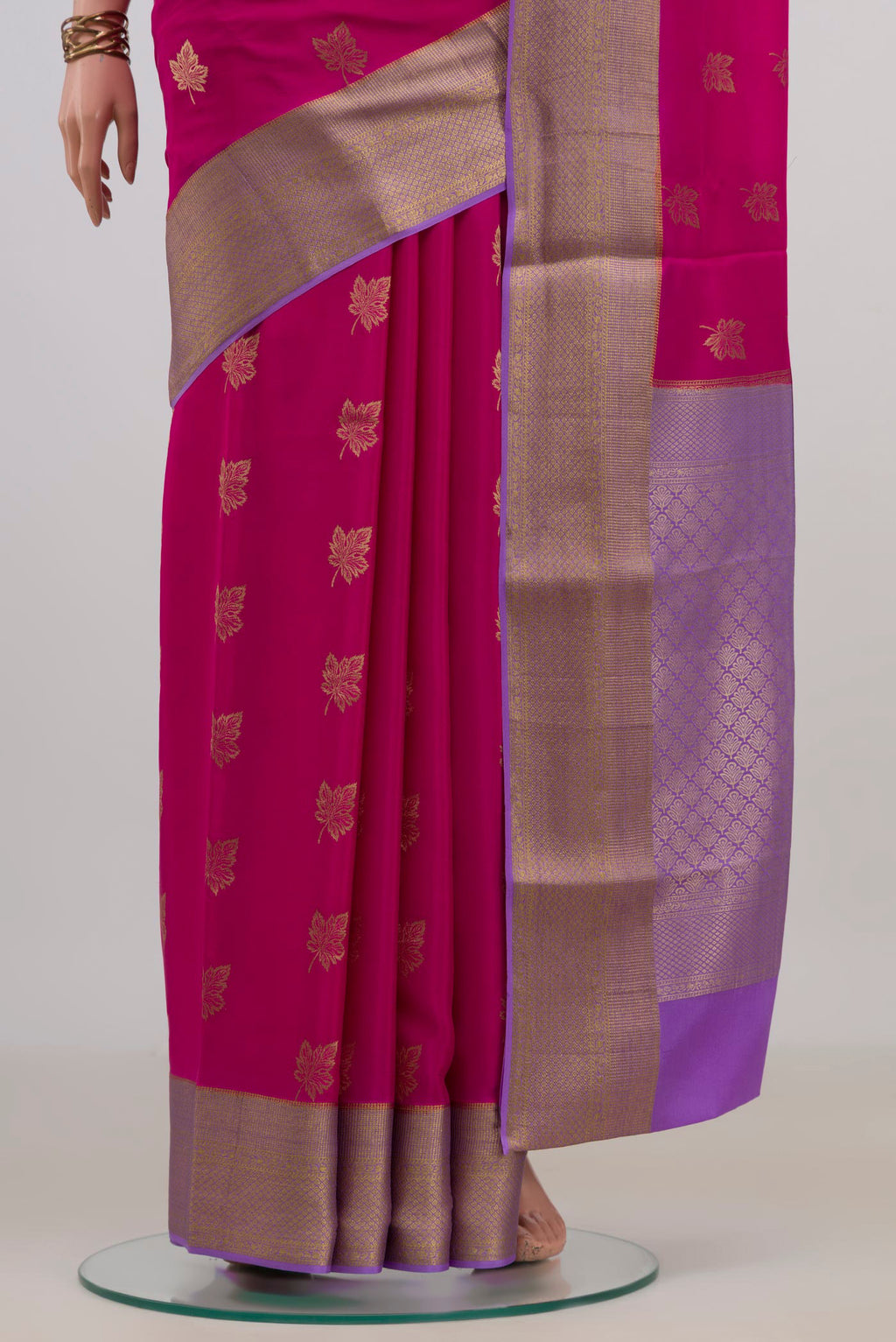Pleats and pallu of Pink Mysore Crepe Saree with Zari Butta on the body and Zari Border. 