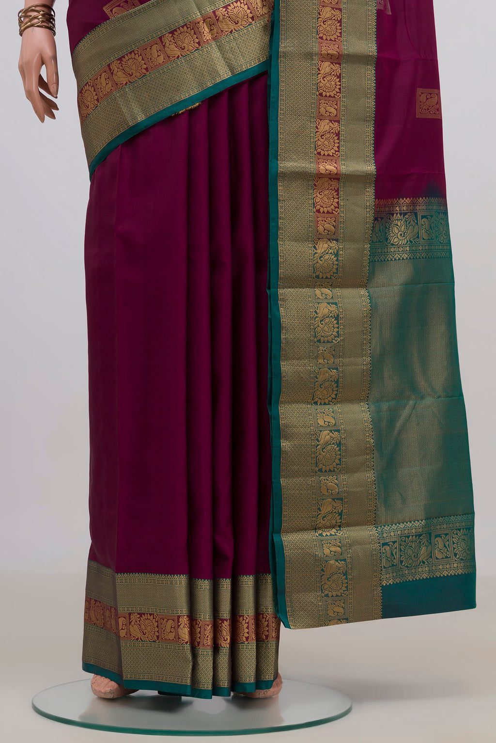 Pleats and pallu of Pure Silk Purple Kanjivaram Saree with Zari Butta on the body and Zari Border. 