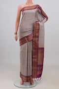 Pure Silk Grey Soft Saree with Zari Butta on the body and Zari Border.  displayed on a mannequin