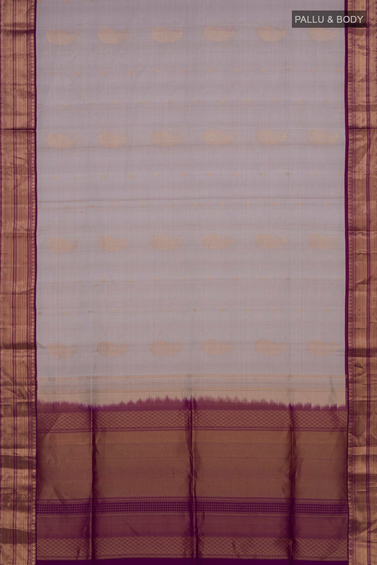 Flat view of Pure Silk Grey Soft Saree with Zari Butta on the body and Zari Border. 