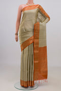 Pure Silk Beige Soft Saree with Zari Butta on the body and Zari Border.  displayed on a mannequin