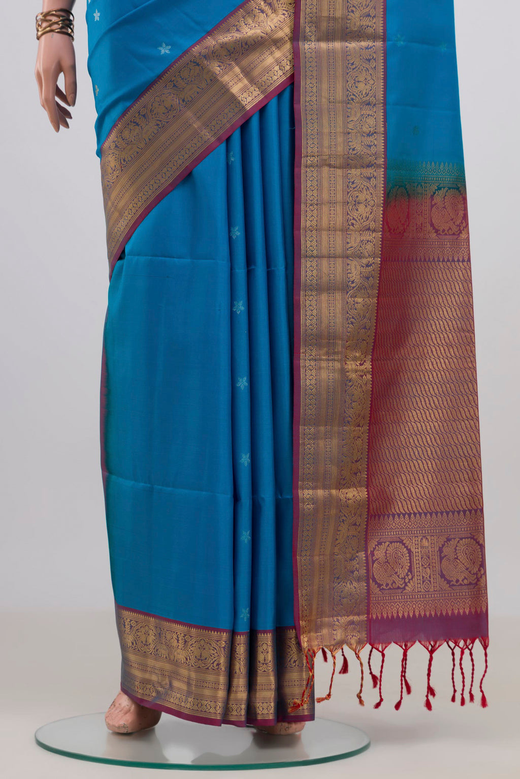 Pleats and pallu of Pure Silk Blue Soft Saree with Zari Butta on the body and Zari Border. 
