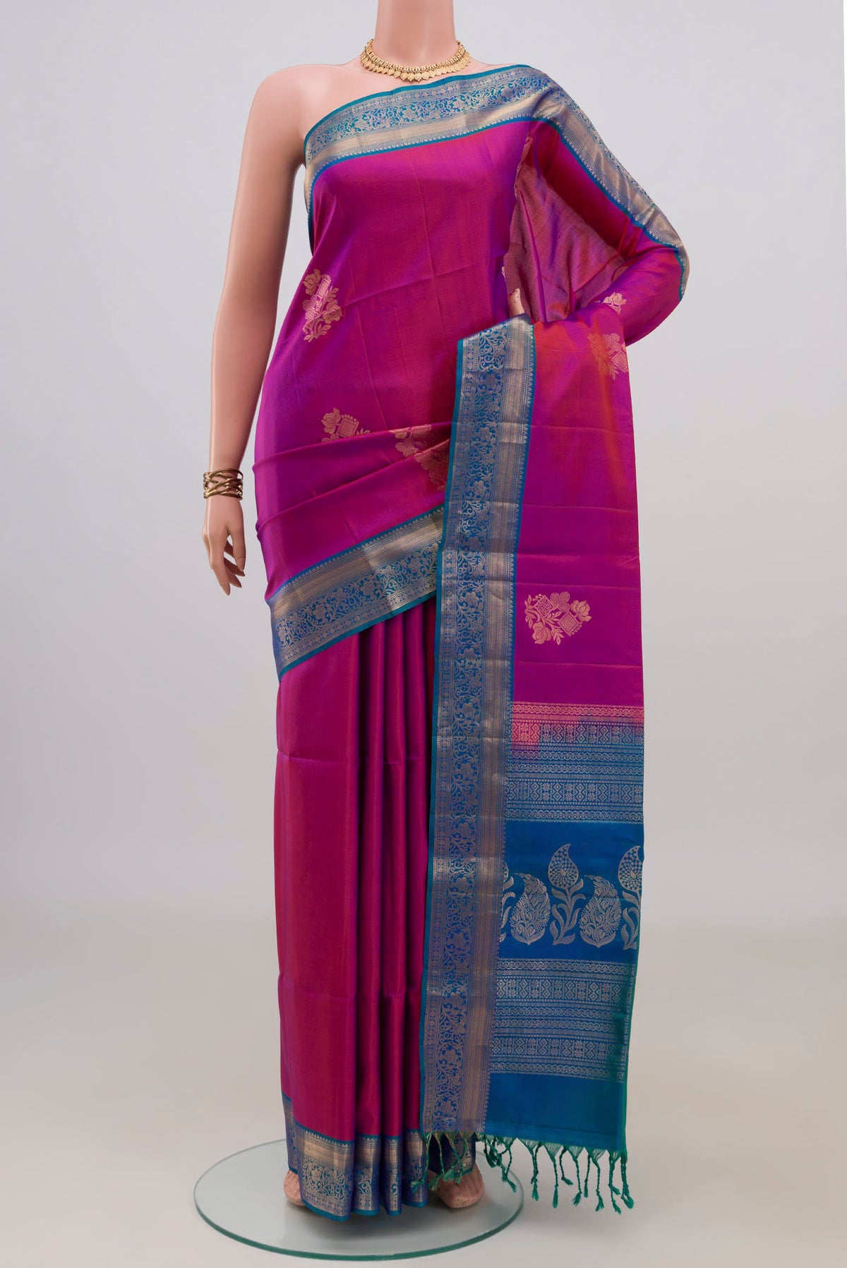 Pure Silk Purple Soft Saree with Zari Butta on the body and Zari Border.  displayed on a mannequin
