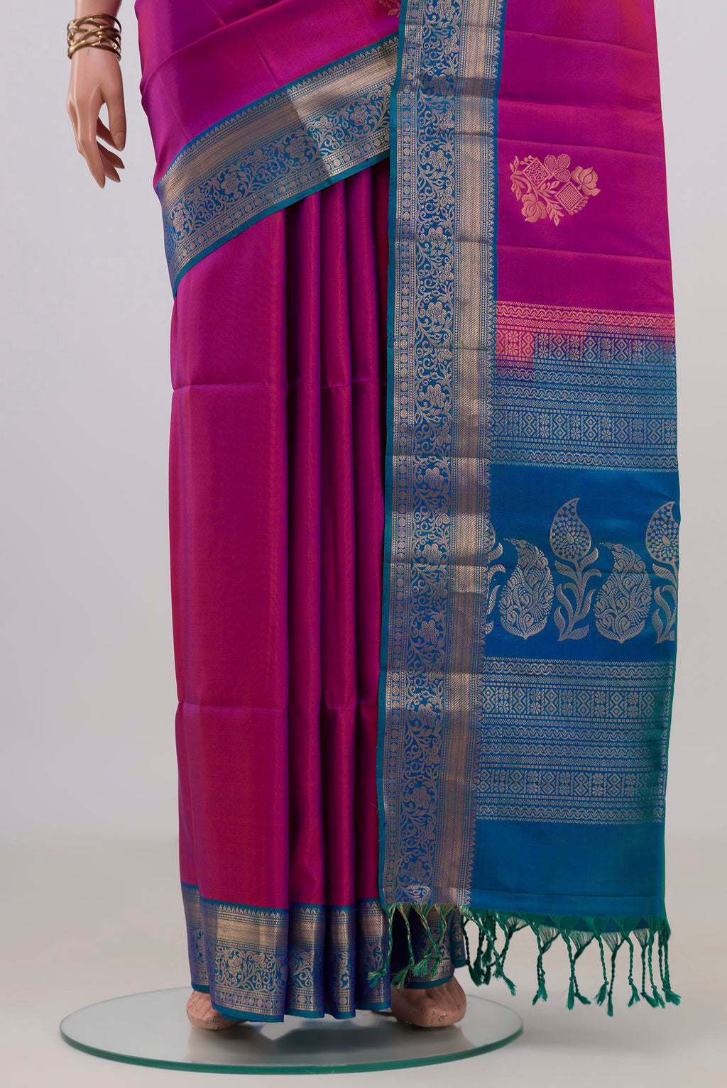 Pleats and pallu of Pure Silk Purple Soft Saree with Zari Butta on the body and Zari Border. 