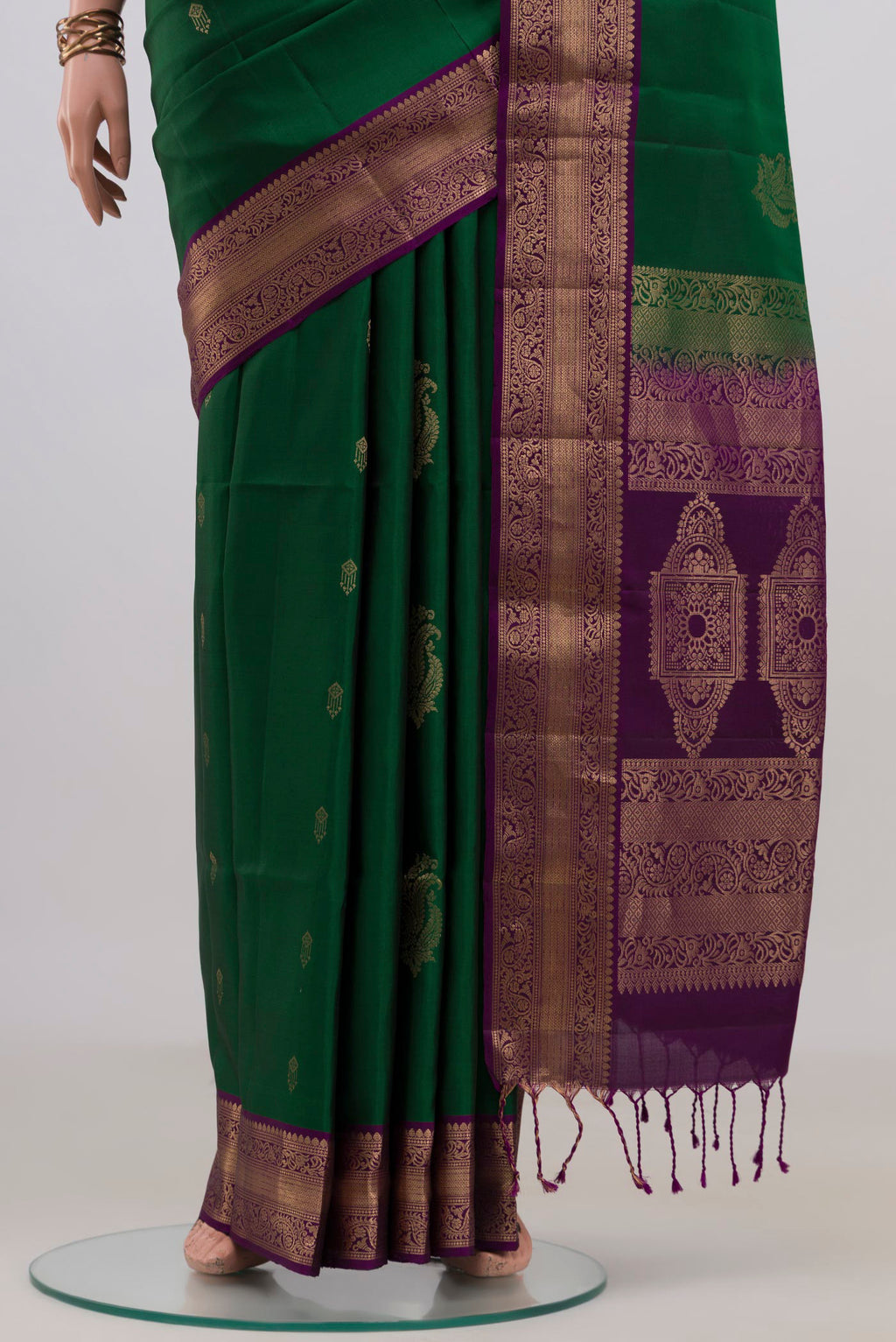 Pleats and pallu of Pure Silk Green Soft Saree with Zari Butta on the body and Zari Border. 