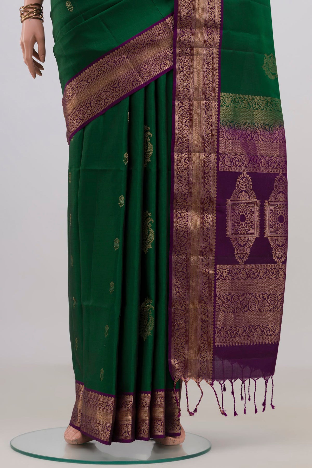 Pleats and pallu of Pure Silk Green Soft Saree with Zari Butta on the body and Zari Border. 
