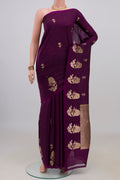 Pure Silk Purple Banarasi Katan Saree with Zari Butta on the body and Without Border.  displayed on a mannequin