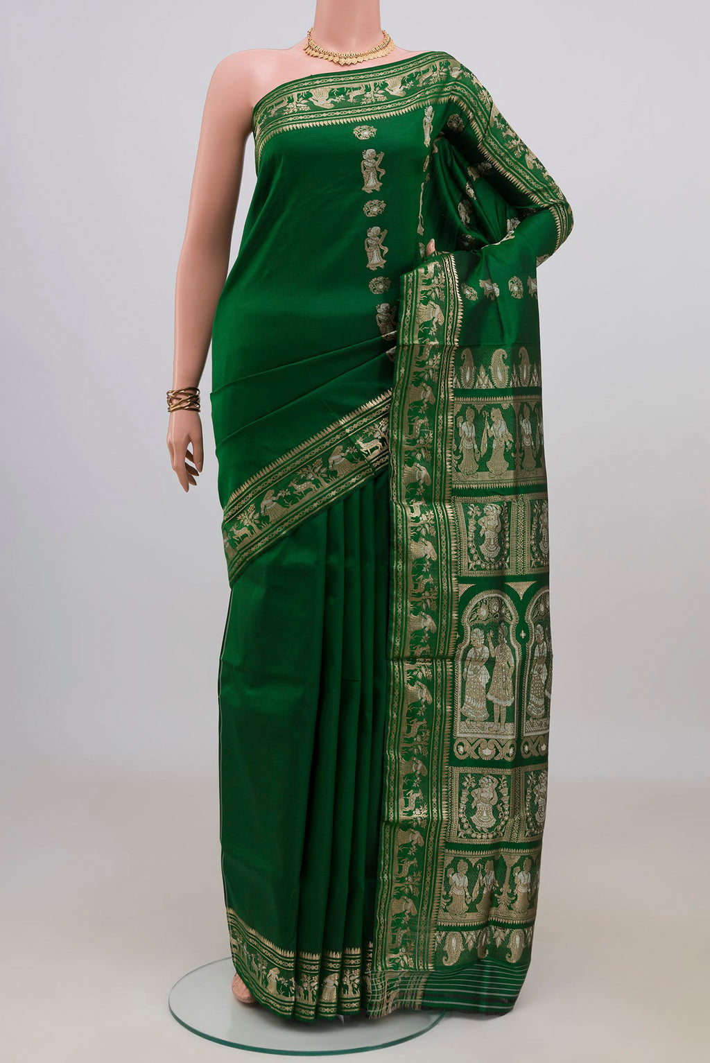 Pure Silk Green Baluchari Saree with Zari And Thread Butta on the body and Zari Border.  displayed on a mannequin