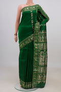Pure Silk Green Baluchari Saree with Zari And Thread Butta on the body and Zari Border.  displayed on a mannequin