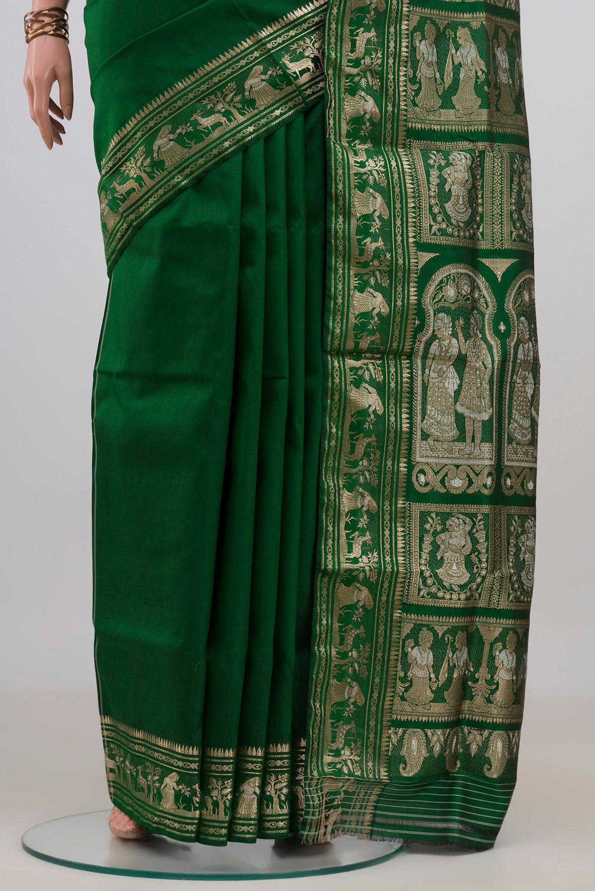 Pleats and pallu of Pure Silk Green Baluchari Saree with Zari And Thread Butta on the body and Zari Border. 