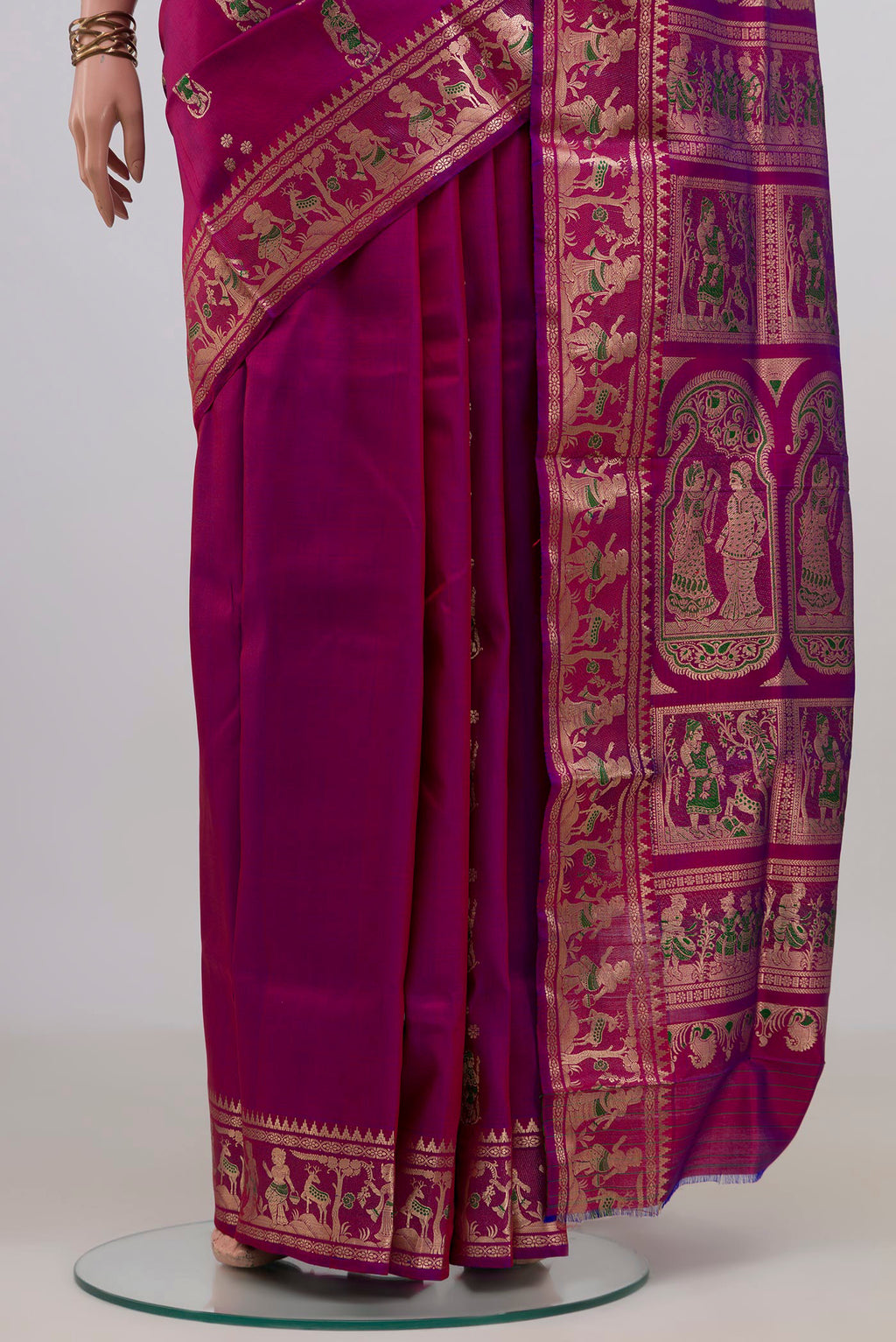 Pleats and pallu of Pure Silk Magenta Baluchari Saree with Zari And Thread Butta on the body and Zari Border. 
