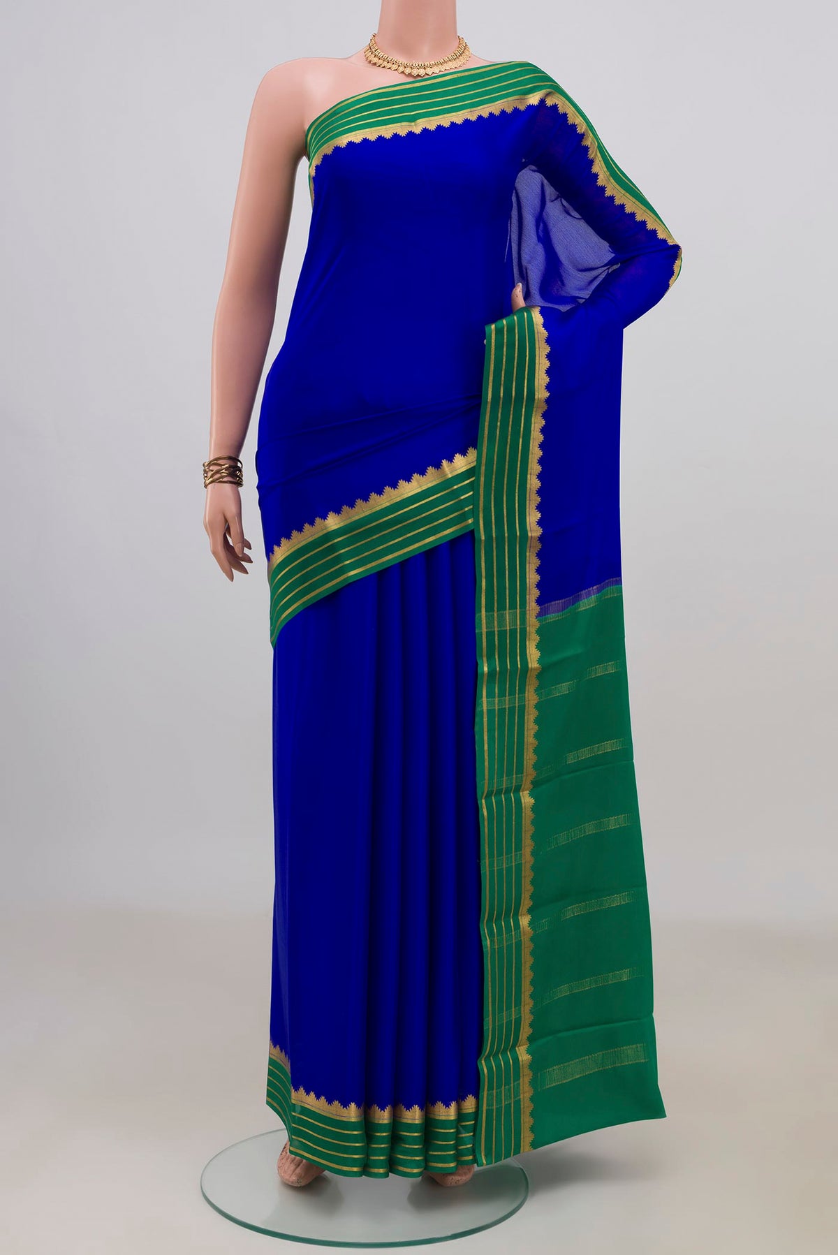 Royal Blue Mysore Crepe Saree with Plain Body and Zari Border.  displayed on a mannequin